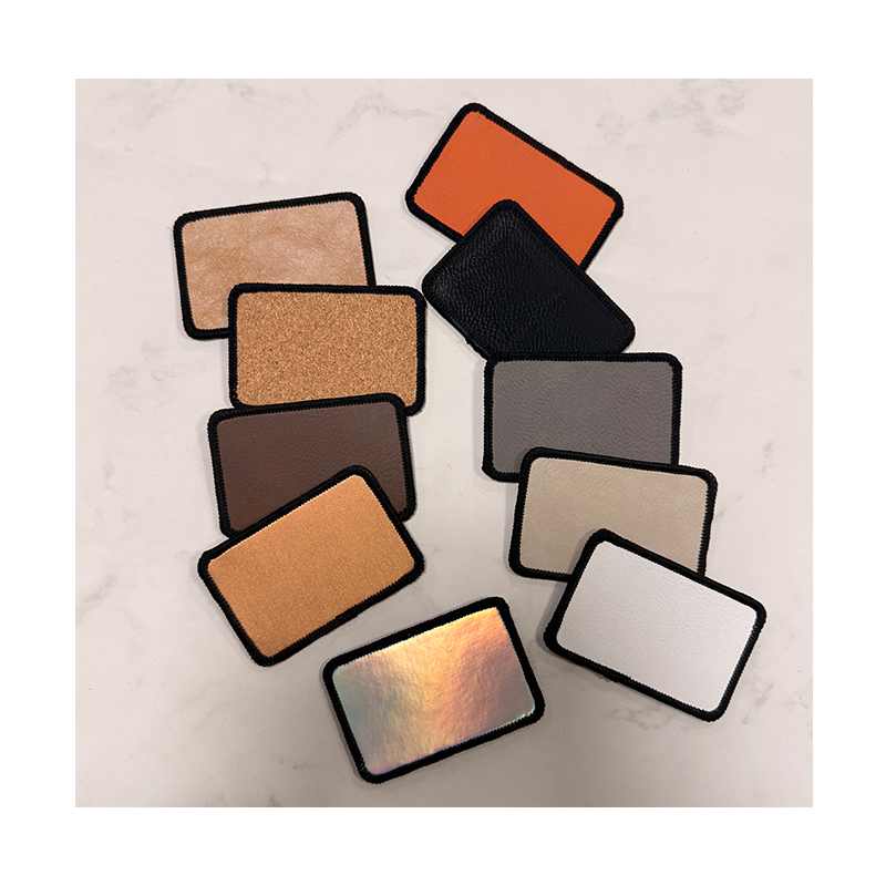 3 1/2' x 2 1/2' rechthoekige laserbare kunstleren Merrow-patch met lijm 3 1/2' x 2 1/2' rechthoekige laserbare kunstleren Merrow-patch met lijm