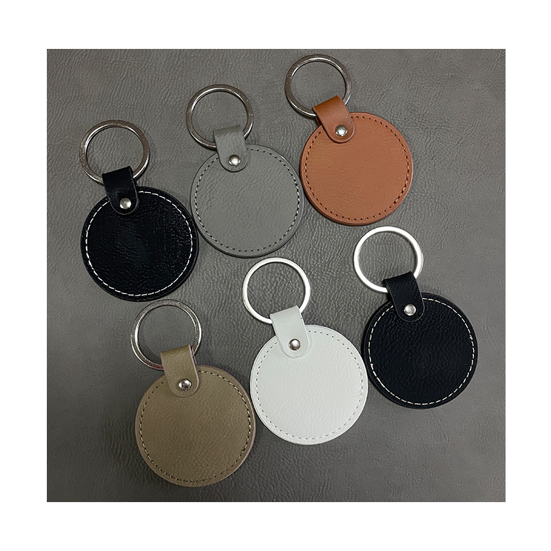 Laserbare ronde sleutelhangers van kunstleer met geoliede rand Laserbare ronde sleutelhangers van kunstleer met geoliede rand
